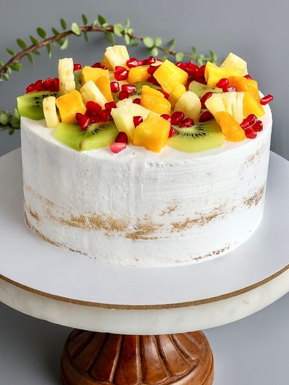This is where the Naked Cake series begins: the Fresh Fruit cake. It features a soft vanilla sponge layered with a variety of seasonal fruits like kiwi, pomegranate, and mango, all held together with a light and silky diplomat cream. It’s refreshing, beautiful, and lets the quality of the fruit do the talking.