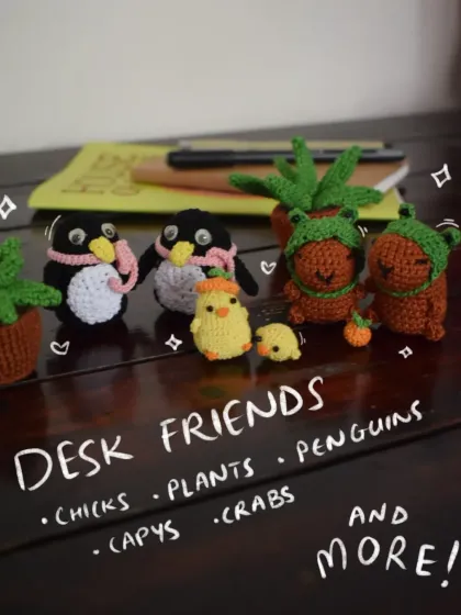 A whole crew of desk friends ready to keep you company! This little gang includes my crochet capybaras, penguins, potted plants, and chicks. They are the perfect, no-fuss companions for your workspace.