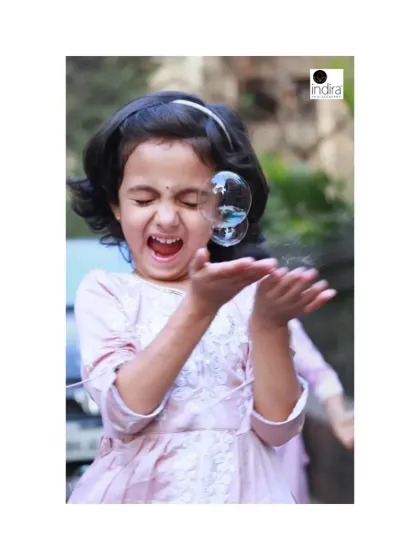 The simple magic of bubbles can bring out the most wonderful expressions. This candid shot from an outdoor sibling portrait session is all about capturing that spontaneous laughter and delight. It’s these unposed, real moments that truly tell your child's story.