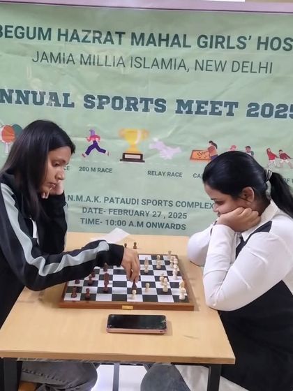 Strategy and focus on display. Students engage in a competitive chess match during the annual sports meet, highlighting the diversity of games we offer.