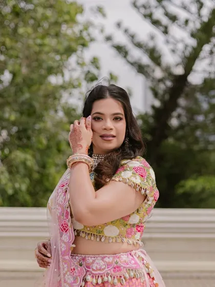 A candid and happy portrait. The makeup is designed to be light and comfortable, allowing the bride to enjoy her pre-wedding functions to the fullest.