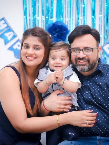 The same beautiful family portrait in color, showing the festive blue theme of the at-home birthday party. We provide a mix of styles to suit your preference.