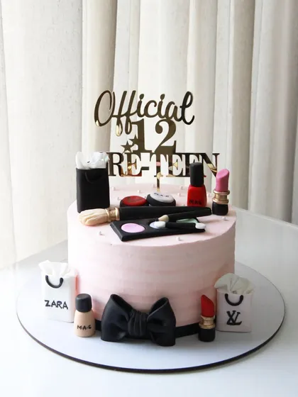 Another angle of the popular makeup-themed cake, a favorite among teens and pre-teens.