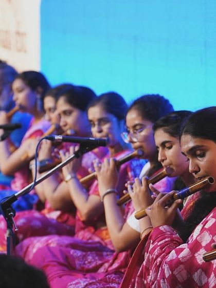 A group of my father's students playing the flute in unison. This image perfectly captures the idea of the Guru Parampara, a river of knowledge flowing from teacher to students.