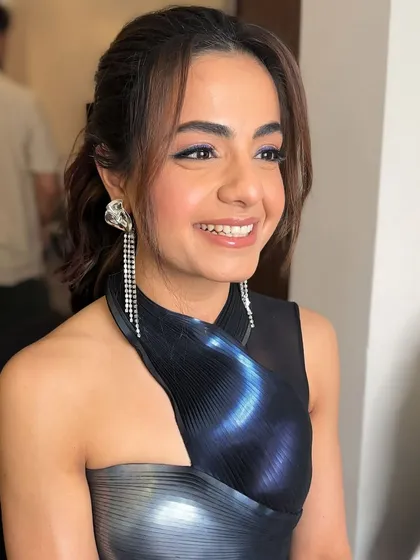 A bright, happy smile. This look is all about having fun with makeup while still looking polished and elegant for a cocktail event.