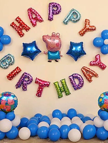 A simple and cute Peppa Pig wall decoration using character and letter foil balloons, perfect for a small celebration at home.