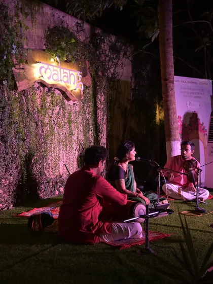 A view of my ensemble during the intimate concert at Namma Ashram. You can see the close communication between me, the violinist, and the mridangam player, which is essential for a cohesive performance.