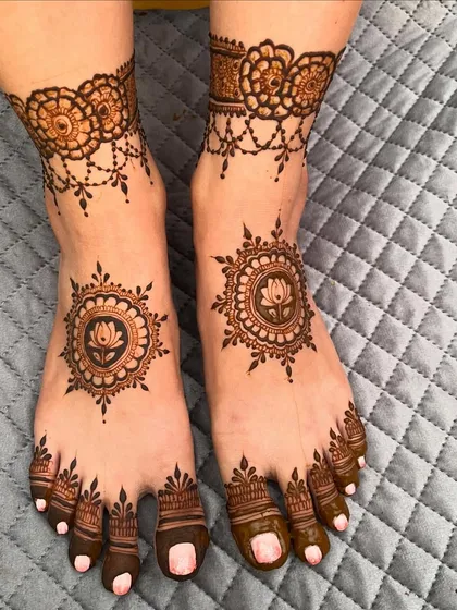 Another view of the minimal lotus mandala feet design. This style is elegant, modern, and very popular for engagements and parties.