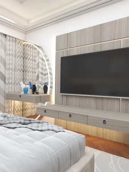 This bedroom TV unit is paired with a floating vanity table, creating a functional dual-purpose area. The wood-paneled wall adds texture and warmth.