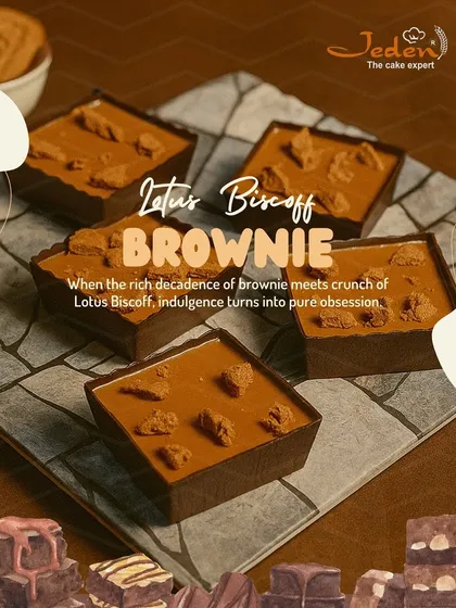 Experience pure obsession with our Lotus Biscoff Brownie. We combine the rich decadence of a fudgy brownie with the unique crunch of Lotus Biscoff to create a truly indulgent treat, as seen in this mouthwatering photo.