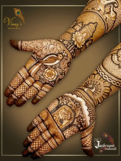 A view of both hands for the groom's sister's mehndi. One hand features a parrot, while the other has an elephant, showcasing a mix of beautiful animal motifs.