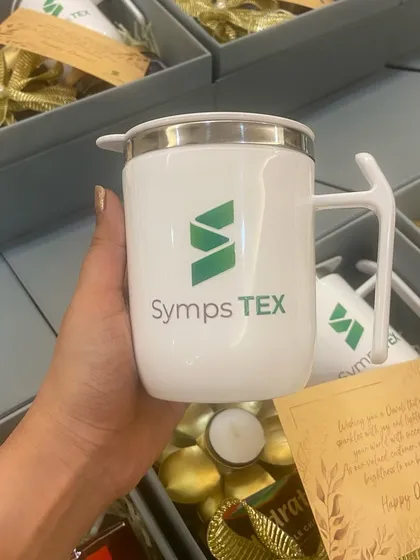 A close-up of the custom-branded mug for Symps TEX, a key feature of our popular corporate gift box.
