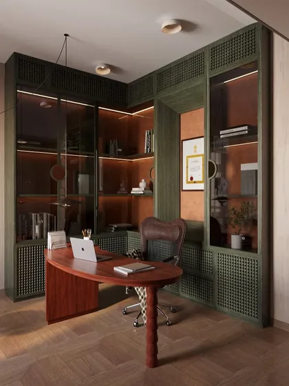A home office should inspire focus. For this study, I chose a sophisticated palette of deep green and rich wood. The design balances the linear structure of the custom bookcase with the soft curve of the desk, creating a workspace that is both powerful and harmonious.