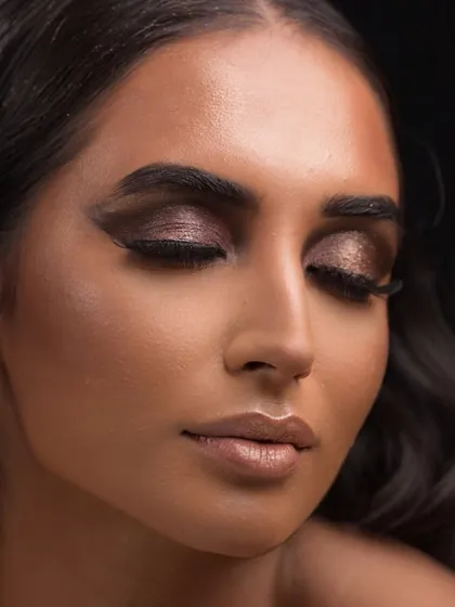 An eyes-closed pose to fully appreciate the depth and dimension of the metallic smokey eyeshadow.