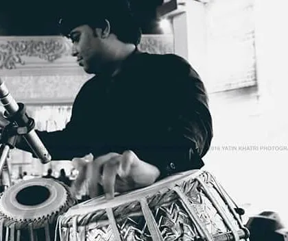 A black and white photograph capturing a moment of deep concentration during a performance. For me, every note is a form of expression, and this image reflects the complete immersion I feel when I play.
