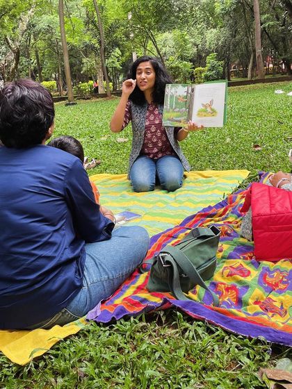 Reading 'The Gruffalo' to an eager audience. Using different voices and expressive gestures, I bring the classic characters of the deep, dark wood to life.