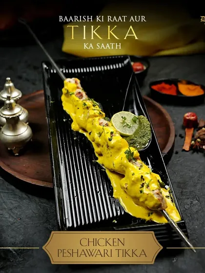 A rainy night is perfect for the company of our Chicken Peshawari Tikka, served sizzling on a skewer.