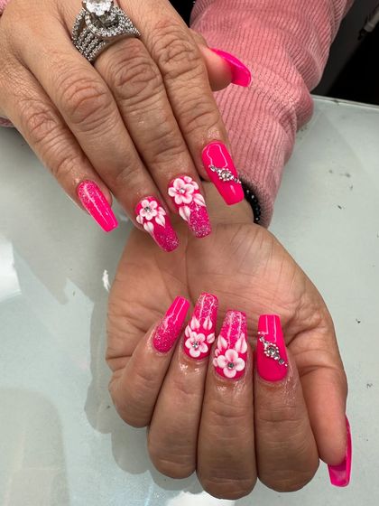 Another view of these stunning pink 3D floral nails, showing the precise placement of each petal and rhinestone.