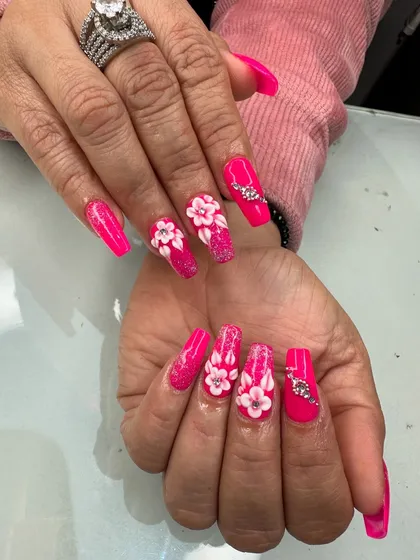 A closer look at this vibrant hot pink set. You can see the detail in the 3D flowers and the placement of the rhinestones.
