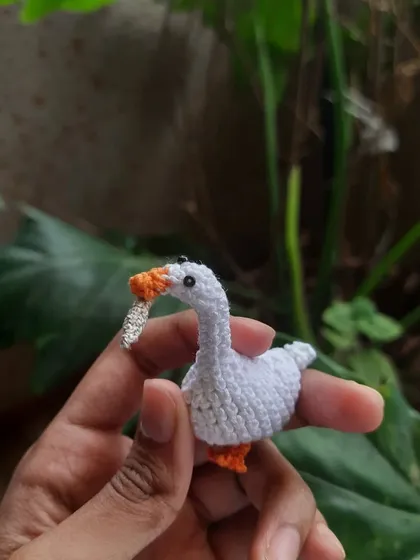Peace was never an option. This menacing goose, inspired by the Untitled Goose Game, comes complete with a tiny (but very sharp) knife. He's one of my most popular and silliest creations.