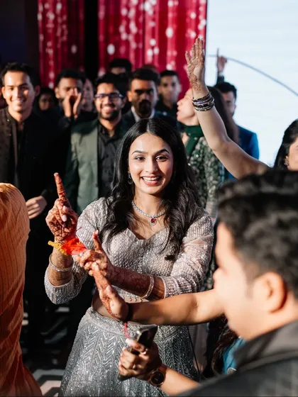 The bride enjoying the dance floor with her friends and family. A Sangeet is a celebration for everyone.