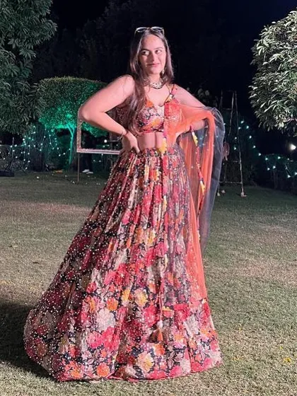 A bold and beautiful floral lehenga on a black base. This rental is perfect for an evening event where you want a floral look with a touch of drama.