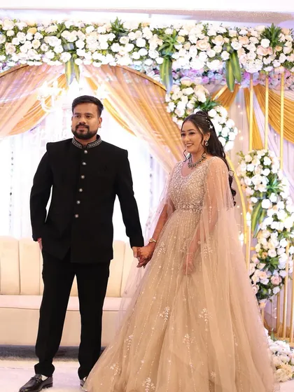 Hand in hand, ready to start their journey. Her glamorous gown and our soft makeup and hair styling came together for a truly picture-perfect engagement look.