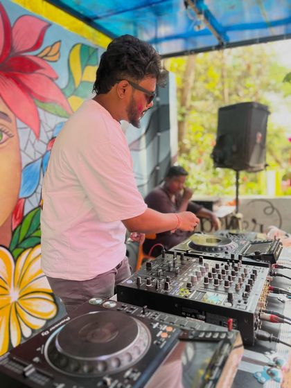 A side view of my setup at the outdoor festival. You can see my full Pioneer console, which I bring to every event to ensure the best sound quality and mixing capability.