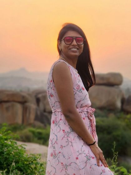 A beautiful portrait of a traveler during sunset at a Hampi viewpoint.