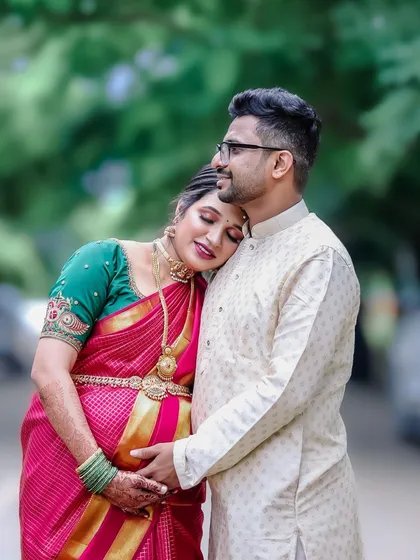 A moment of peace and togetherness. This intimate portrait from a traditional baby shower session shows the couple finding a quiet moment amidst the celebrations.