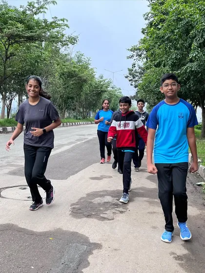 Our students jogging together near Hulimavu lake. Cardiovascular exercise is key for building the stamina required for long shooting competitions.