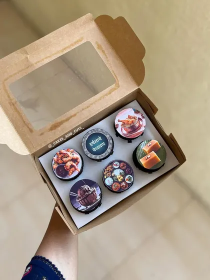 Kelvan special cupcakes. Each cupcake has an edible print showing different elements of Maharashtrian culture and food, making them a unique and thoughtful gift.