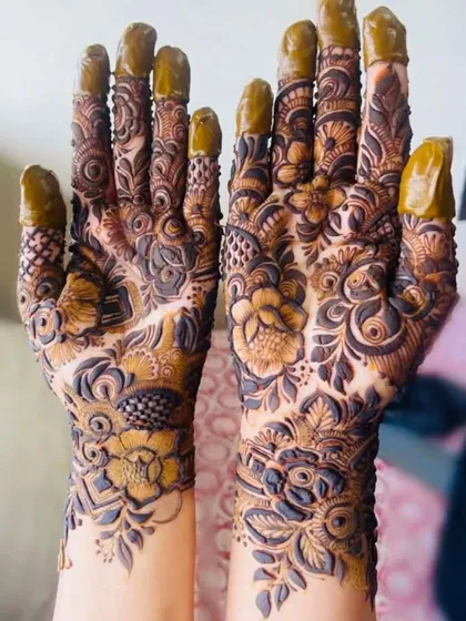 This design is packed with detail, from the shaded flowers to the intricate patterns on the fingers.