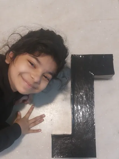 That smile says it all. After finishing her periscope project, she was so happy with what she had created. This is the confidence that comes from hands-on achievement.