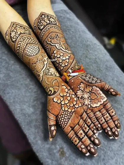 A beautiful design with a mix of floral and paisley patterns, showing the rich color of the henna stain.
