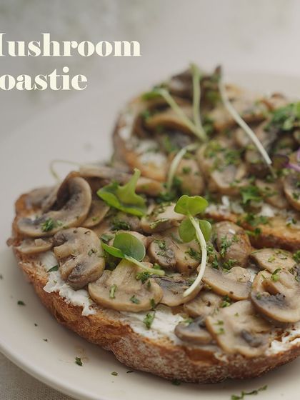 My Mushroom Toastie is a crowd favorite. It features earthy, sautéed mushrooms over a layer of cream cheese on toasted bread, garnished with fresh microgreens.