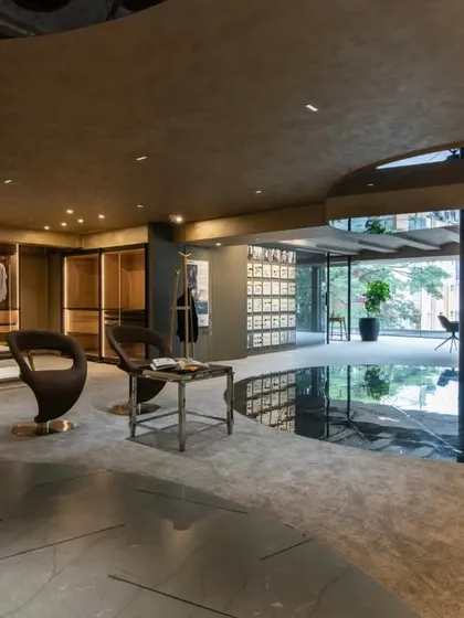 Additional views of the Gala showroom, showcasing the luxurious walk-in closet displays, the reflective marble floor, and the seamless integration of product showcases into the architectural design.