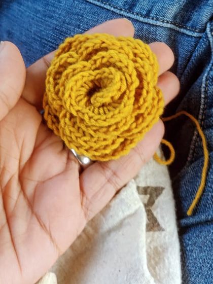 A sunny yellow rose I crocheted during a cab ride. I always carry my crochet kit with me, turning any spare moment into a creative opportunity.