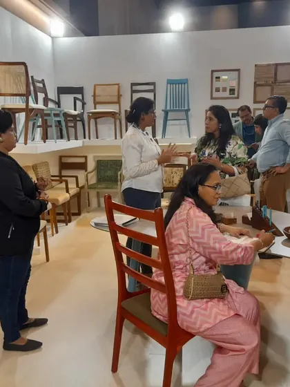 A busy moment at the Darsh Designs booth, with many visitors exploring the furniture and talking with my team.