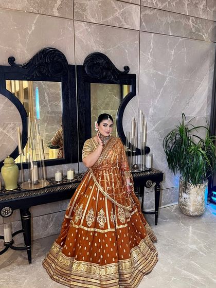 Loving the details of this beautiful orange and gold lehenga.