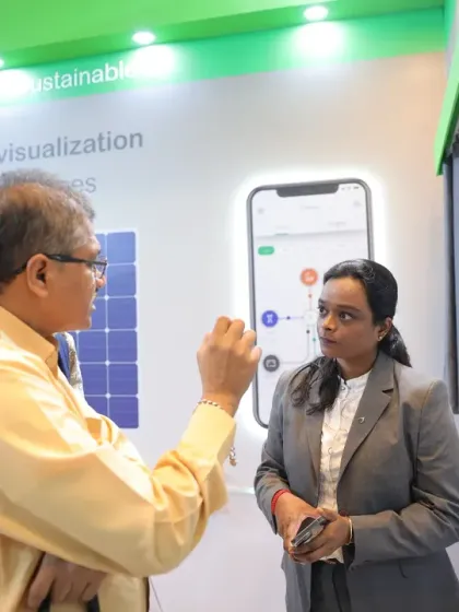 An exhibitor explains the energy flow visualization of a sustainable smart home solution. We are a platform for green technology and energy-efficient innovations.