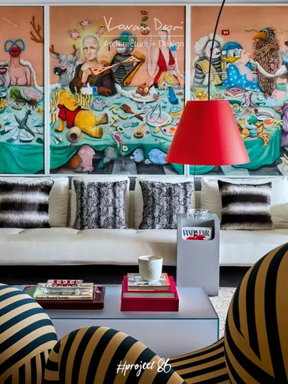 This living room was designed to be both formal and relaxed. We paired a contemporary bubble couch from Roche Bobois with a classic B&B Italia sofa, and brought it all to life with a massive, vibrant piece of art by Siddhartha Kararwal.