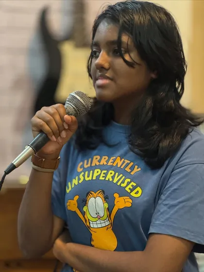 This student is learning to command the microphone and connect with her audience. Our classes build not just vocal skills but also stage presence.