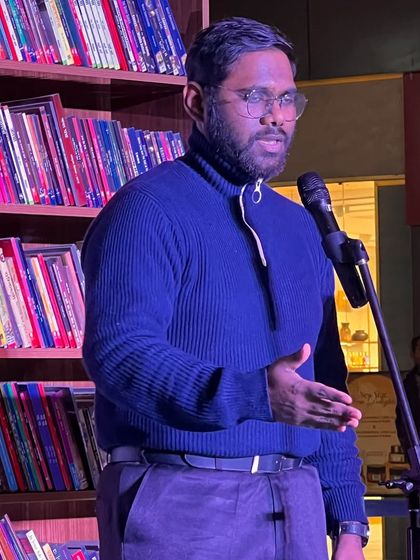 A close-up of a poet delivering an intense performance. We feature artists who bring a high level of emotion and skill to the stage.