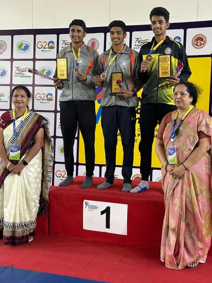 The team event podium at the All India School Games, celebrating the gold medal win.