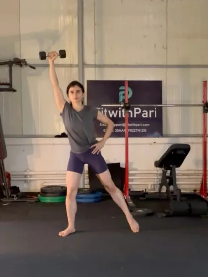 A standing side bend with a dumbbell. This move sculpts the waistline and improves lateral spinal flexion.