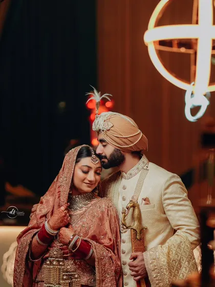 A tender moment between the bride and groom. The bride's soft makeup look enhances her natural beauty, creating a romantic and timeless image.