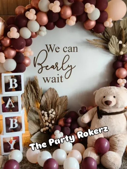 A modern and chic "We Can Bearly Wait" themed baby shower. We used a sophisticated color palette of maroon, beige, and rose gold balloons, with a large teddy bear and pampas grass for a warm, bohemian feel.