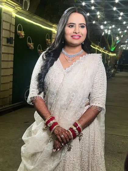 A bright smile from the bride, looking absolutely radiant and ready to celebrate her reception.