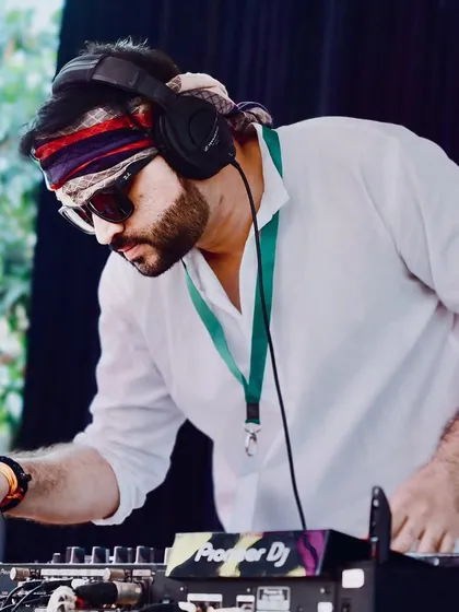 In the zone at a Holi event. For me, DJing is about being completely focused on the music and the crowd, finding that perfect next track to keep the energy high. This is my happy place.